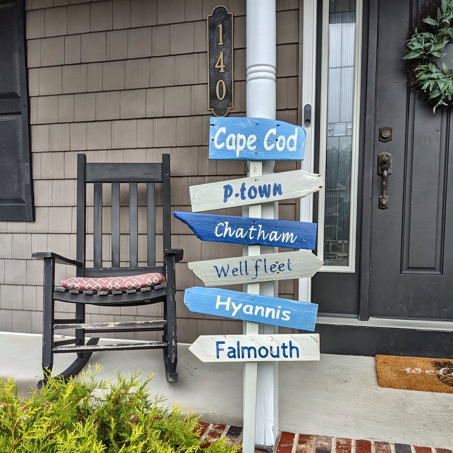 A Cape Cod sign on a porch