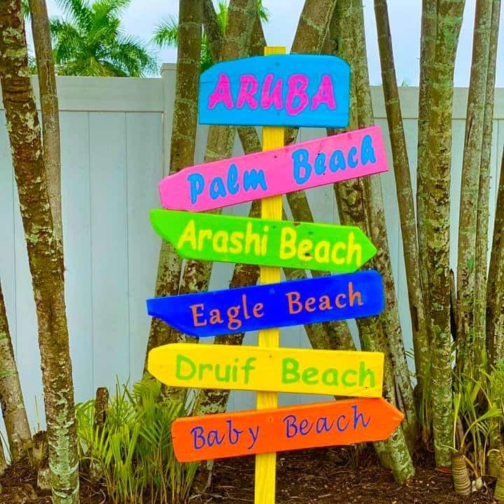 Aruba sign among tropical plants