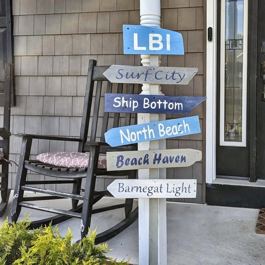 An LBI sign on a porch with a rocking chair