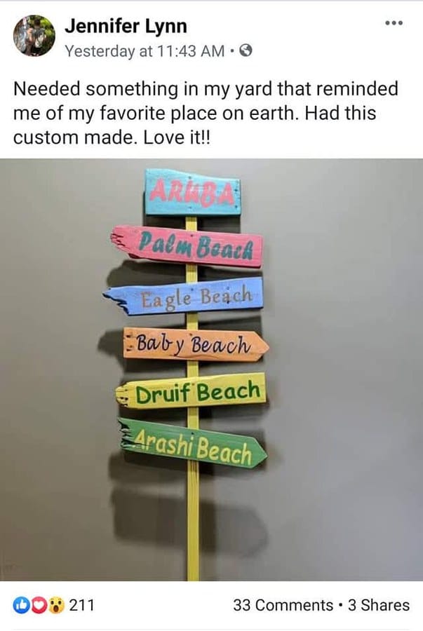 The original Facebook post showing the first Aruba sign, with 211 reactions and 33 comments