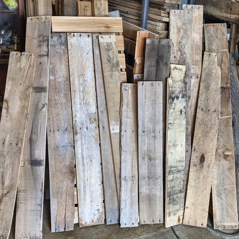 A stack of reclaimed pallet boards in the woodshop